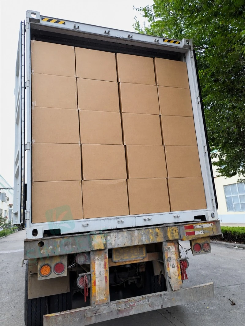 eco-friendly disposable waterproof bed pads shipment crew tying protective net by truck headlights at dusk eco-friendly disposable waterproof bed pads shipment crew tying protective net by truck headlights at dusk